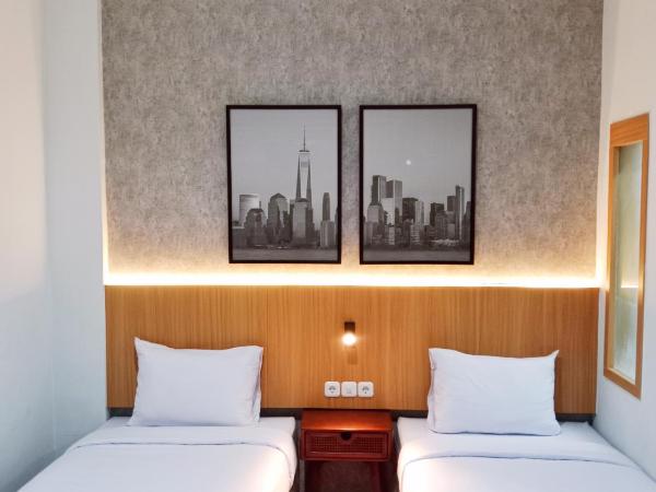 Andita Syariah Hotel : photo 2 de la chambre chambre lits jumeaux deluxe