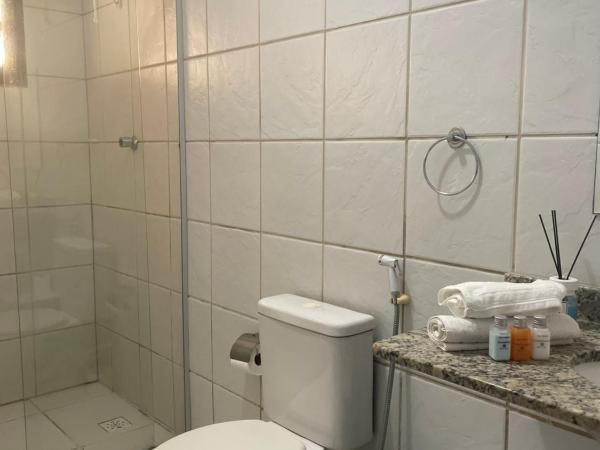 Pousada Jardim Magico : photo 6 de la chambre chambre quadruple avec salle de bains privative