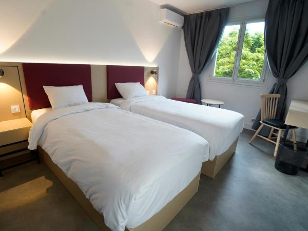 Anaïs Hôtel Bourges Nord Saint-Doulchard : photo 6 de la chambre chambre lits jumeaux pour personnes à mobilité réduite