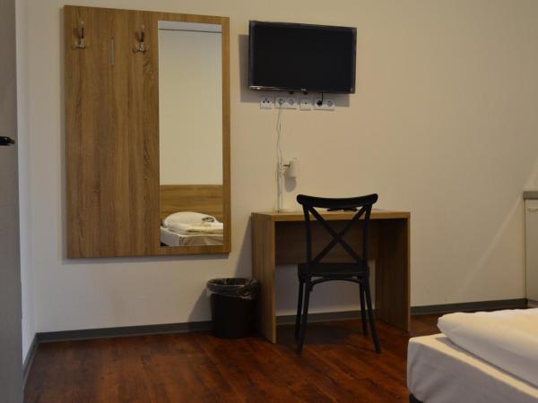 Queens Residenz : photo 6 de la chambre chambre triple