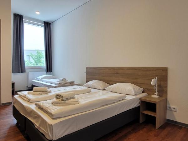 Queens Residenz : photo 5 de la chambre chambre triple