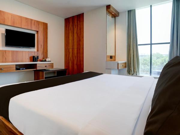 Super Hotel O Om Tapovan : photo 1 de la chambre chambre triple classique