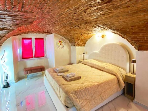 Lovely homes : photo 1 de la chambre chambre lit king-size avec baignoire spa