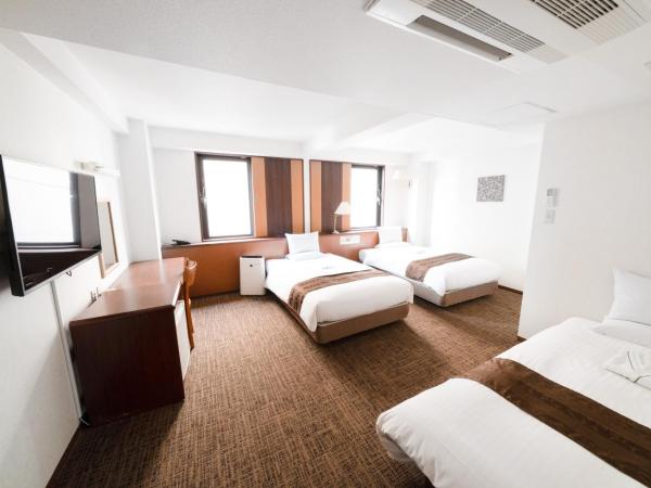 Toyo Hotel : photo 1 de la chambre chambre lits jumeaux avec lit d'appoint - non-fumeurs