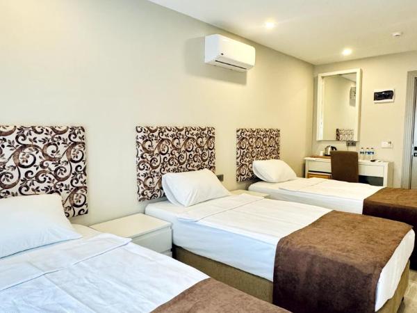 Toprak City Hotel Antalya : photo 2 de la chambre chambre triple - vue sur ville