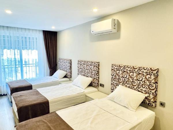 Toprak City Hotel Antalya : photo 1 de la chambre chambre triple - vue sur ville