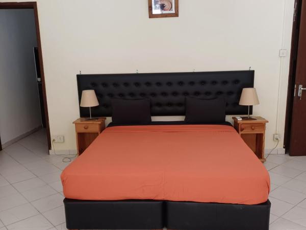 Le Palmier : photo 4 de la chambre chambre double - vue sur piscine