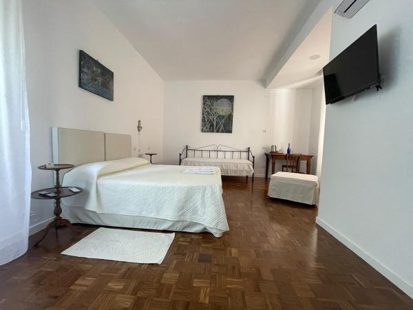 Locanda dei Buoni e Cattivi : photo 2 de la chambre chambre triple supérieure