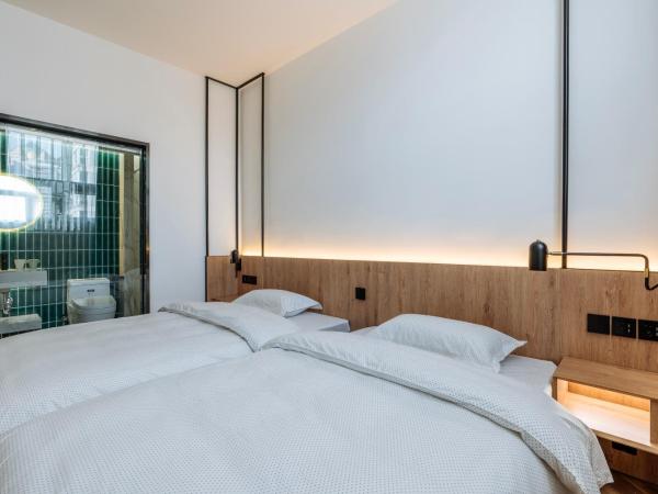 POSHPACKER·Chengdu Local Tea Hostel : photo 1 de la chambre chambre lits jumeaux standard avec salle de bains privative