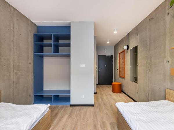 NextDoor Apartments : photo 7 de la chambre chambre lits jumeaux