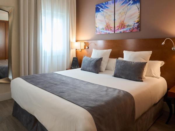 Hotel Puerta de Toledo : photo 6 de la chambre chambre double ou lits jumeaux