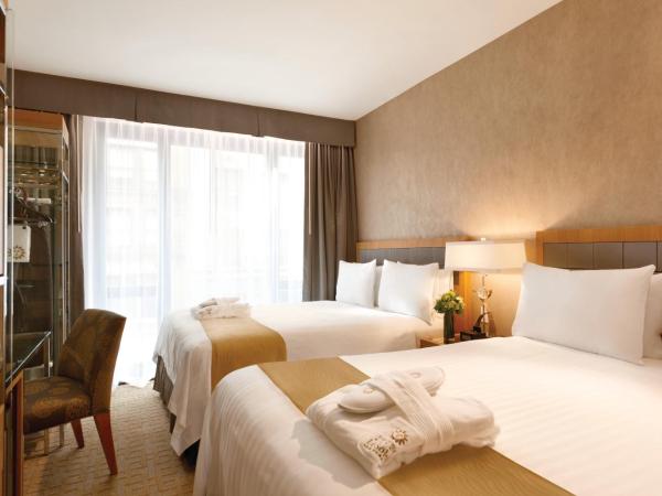 Executive Hotel Le Soleil New York : photo 6 de la chambre chambre exécutive avec deux lits queen-size