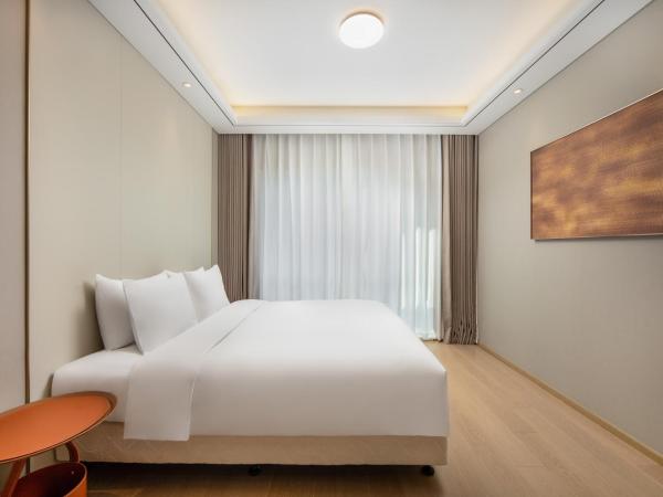 苏州山塘街华贸姑苏里服务公寓 : photo 4 de la chambre studio