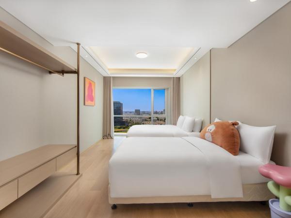 苏州山塘街华贸姑苏里服务公寓 : photo 2 de la chambre suite familiale