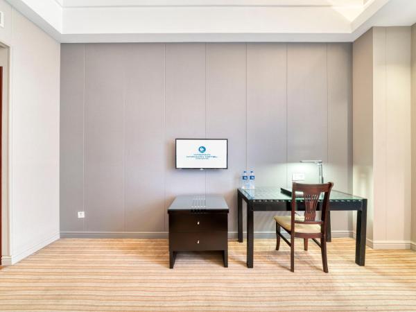 海外海纳川酒店拱墅万达广场渡驾桥地铁站店 : photo 1 de la chambre chambre standard