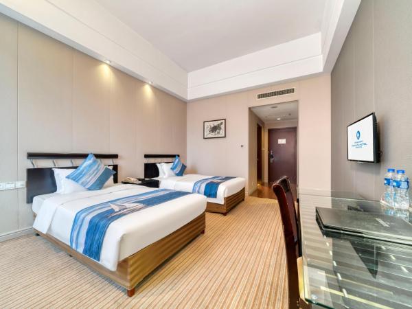 海外海纳川酒店拱墅万达广场渡驾桥地铁站店 : photo 2 de la chambre chambre standard