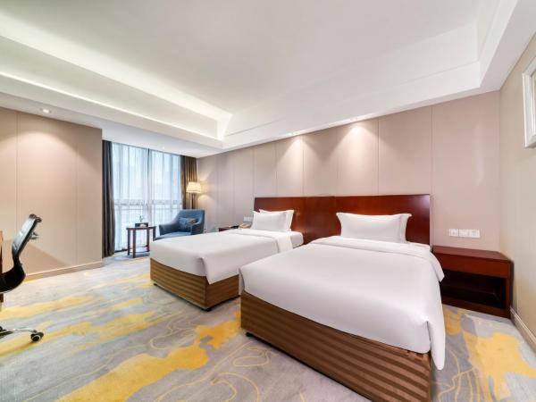 海外海纳川酒店拱墅万达广场渡驾桥地铁站店 : photo 6 de la chambre chambre lits jumeaux deluxe