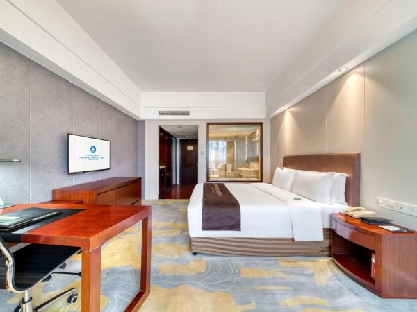海外海纳川酒店拱墅万达广场渡驾桥地铁站店 : photo 1 de la chambre chambre affaires lit queen-size