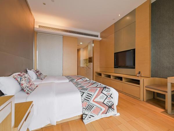 Snug Gaokong Jiangjing Hotel : photo 2 de la chambre chambre lits jumeaux deluxe