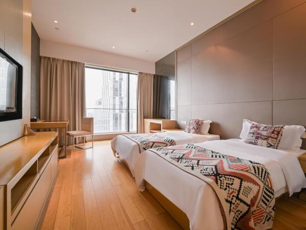 Snug Gaokong Jiangjing Hotel : photo 1 de la chambre chambre lits jumeaux deluxe