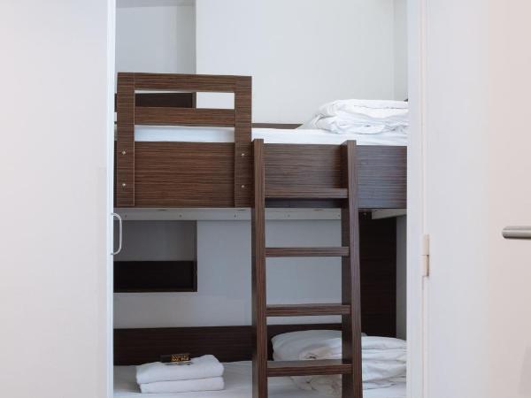 Hôtel & Appartements Monsigny : photo 2 de la chambre chambre quadruple