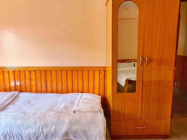 Sanjie Bhumi Guest House : photo 1 de la chambre petite chambre double