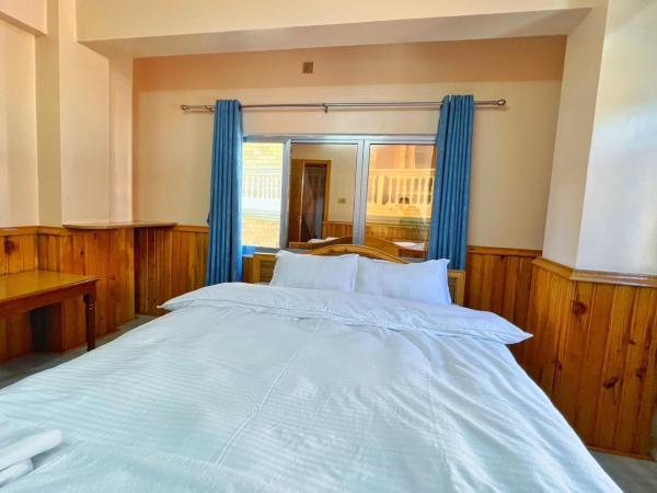 Sanjie Bhumi Guest House : photo 1 de la chambre chambre double