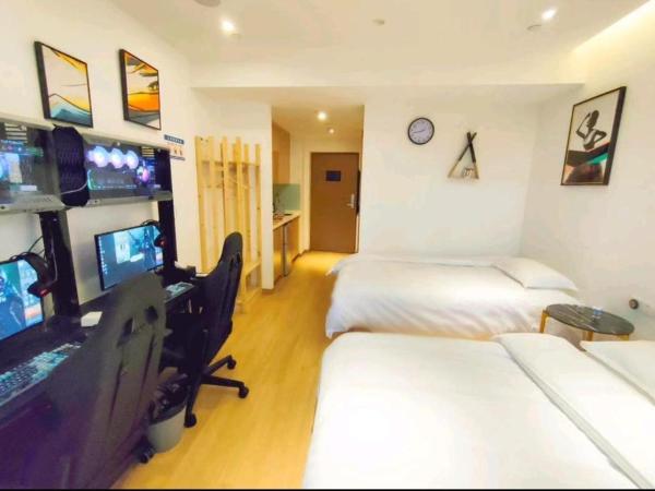 Muyu E-SPORT HOTEL慕鱼电竞酒店 : photo 2 de la chambre chambre lits jumeaux avec salle de bains privative