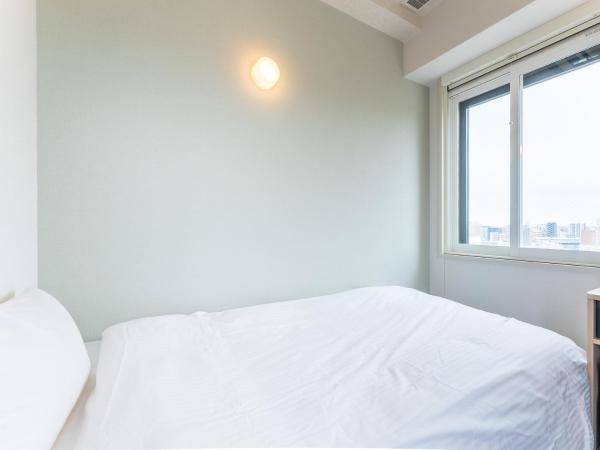 Tabist TOKYO CITY VIEW HOTEL : photo 1 de la chambre chambre simple de luxe avec vue sur la ville
