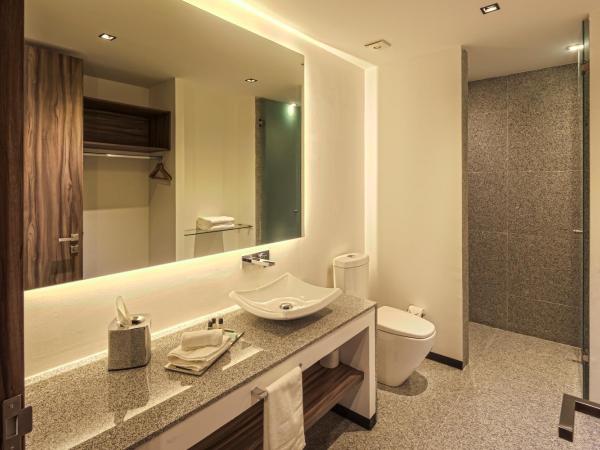 Kharma Suites : photo 4 de la chambre chambre lit king-size deluxe