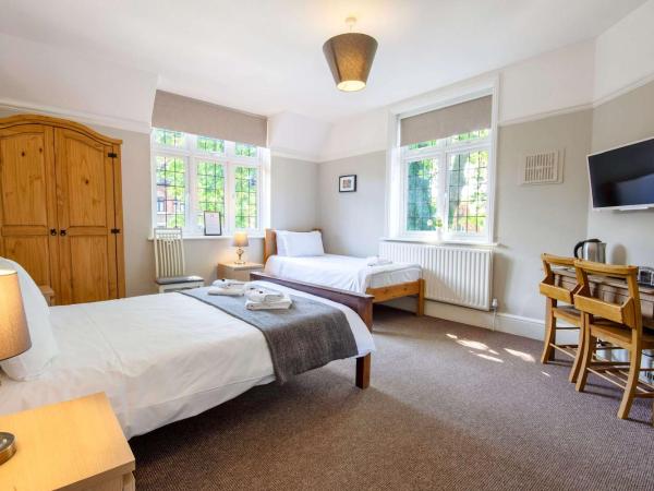 The Green W7 : photo 2 de la chambre chambre triple avec salle de bains commune