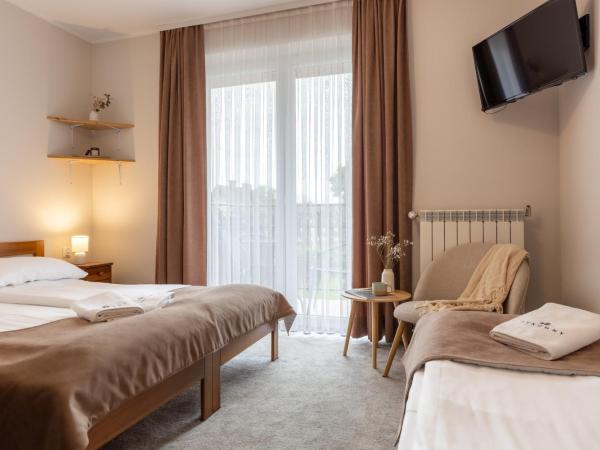 Sykowny Biały Dunajec : photo 1 de la chambre chambre triple avec balcon