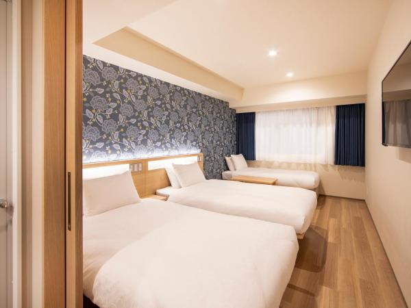 karaksa hotel TOKYO STATION : photo 1 de la chambre chambre lits jumeaux standard avec lit d'appoint
