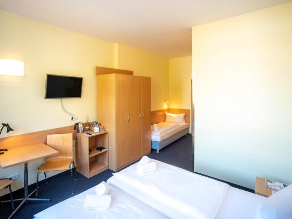 Familienhotel Citylight : photo 2 de la chambre chambre triple