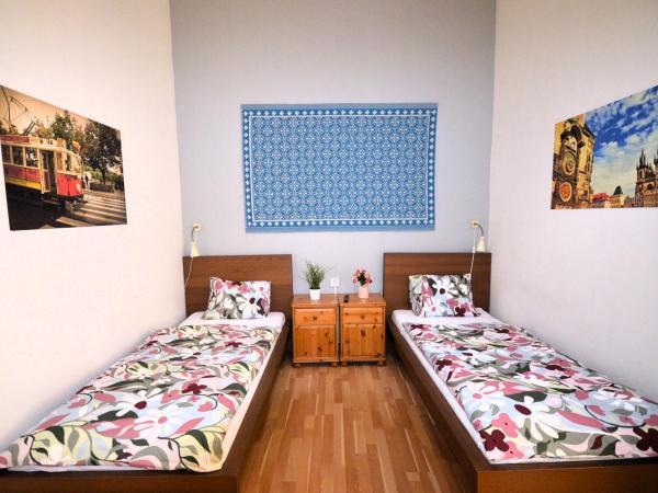 Travel&Joy backpackers : photo 2 de la chambre chambre lits jumeaux supérieure avec salle de bains commune