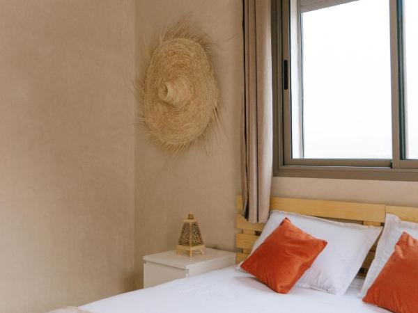 Flo Surf Morocco : photo 2 de la chambre chambre double ou lits jumeaux - vue latérale sur mer