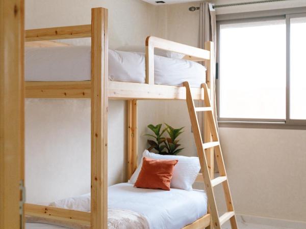 Flo Surf Morocco : photo 1 de la chambre chambre quadruple avec salle de bains commune