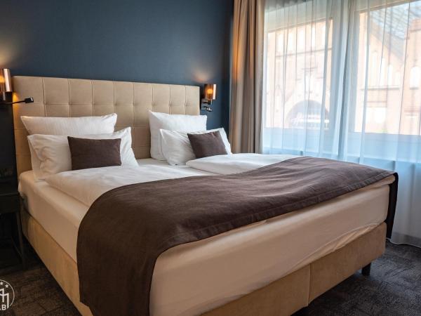 Hotel am Borsigturm : photo 1 de la chambre suite deluxe avec lit king-size