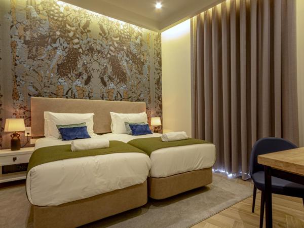 Guest House Jacarandá Faro : photo 6 de la chambre chambre lits jumeaux