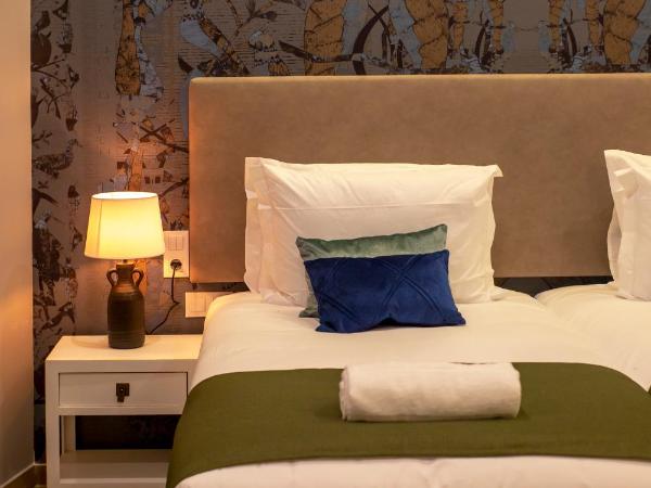 Guest House Jacarandá Faro : photo 7 de la chambre chambre lits jumeaux