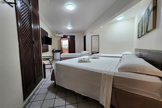 Pizzato Praia Hotel : photo 4 de la chambre chambre quadruple