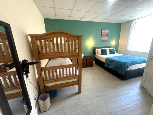 The Aspire : photo 3 de la chambre chambre familiale (2 adultes et 2 enfants)