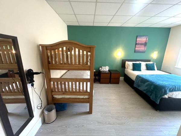The Aspire : photo 2 de la chambre chambre familiale (2 adultes et 2 enfants)