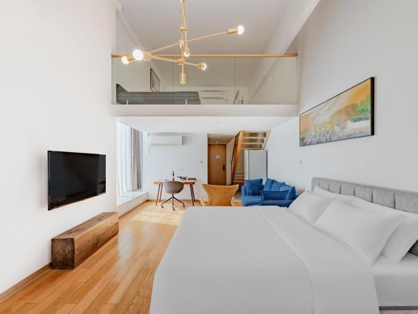 上海芳甸路地铁站Boutique酒店 : photo 1 de la chambre chambre quadruple premium