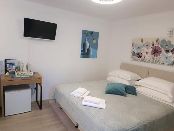 Apartment & Room Pajolo : photo 2 de la chambre chambre double ou lits jumeaux avec terrasse - vue sur jardin