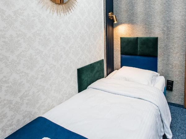 Elegant Apartments : photo 8 de la chambre chambre lits jumeaux avec salle de bains privative