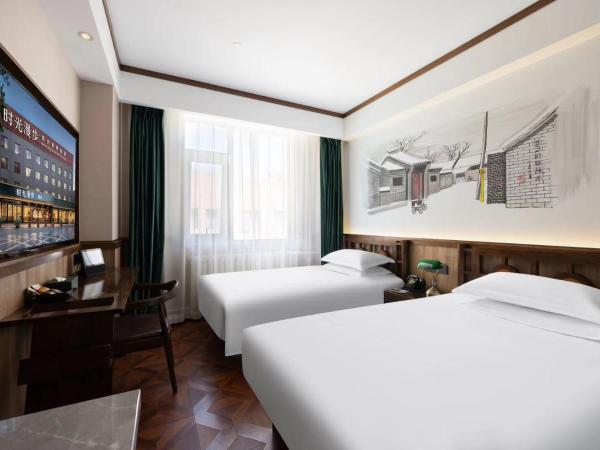 Time Traveller Hotel - Near Beijing Panjiayuan Antique Market, Beijing Happy Valley, CBD, China Zun and Sanlitun, Tian'anmen Square, Free ice cream, mineral water, coffee, snacks and laundry service, Free gymnastic, English communication well : photo 6 de la chambre chambre lits jumeaux
