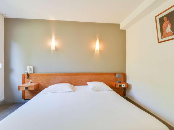 Brit Hotel Notre Dame : photo 1 de la chambre chambre double standard avec baignoire