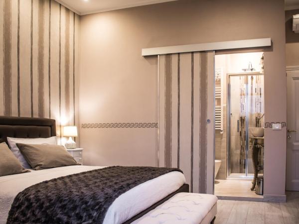 Dolci Mura Luxury Rooms : photo 5 de la chambre chambre triple avec salle de bains privative