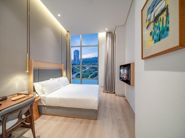 Wuyu Hotel - Chongqing Liangjiang Happiness Plaza : photo 3 de la chambre chambre lit queen-size deluxe